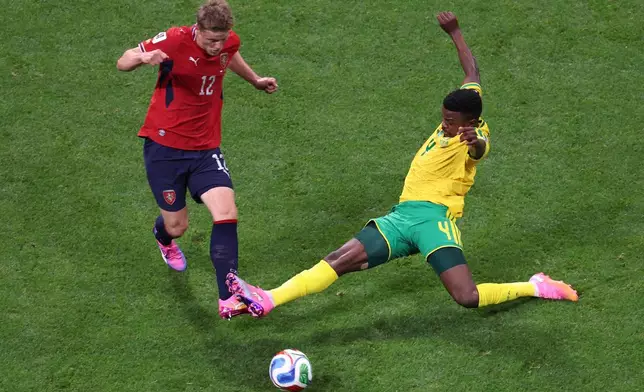 South Africa's Teboho Mokoena (4) tackles Czechia's Lukas Cerv (12) during the World Cup Group A soccer match between Czechia and South Africa in Atlanta, Thursday, June 18, 2026. (AP Photo/Colin Hubbard)