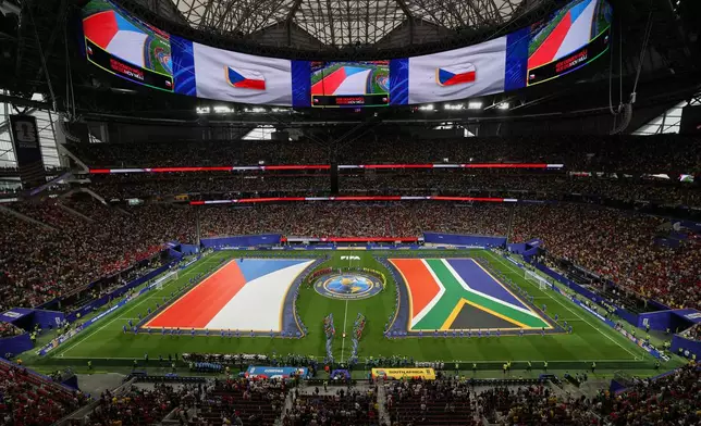Czechia's and South Africa's flags are seen on the pitch before the World Cup Group A soccer match between Czechia and South Africa in Atlanta, Thursday, June 18, 2026. (AP Photo/Colin Hubbard)