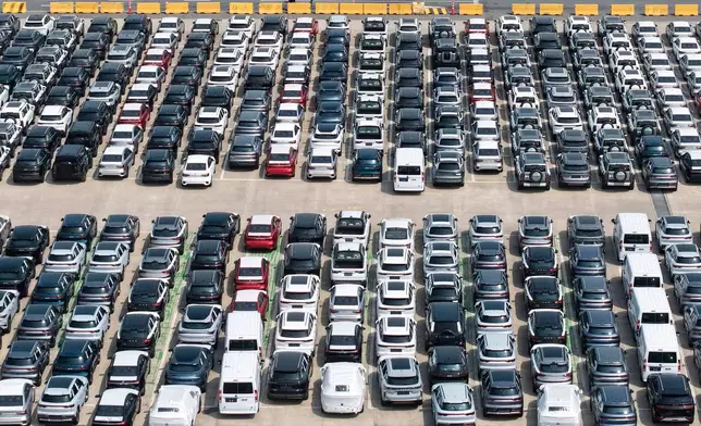 FILE - Aerial view of new vehicles waiting for shipment to overseas market at a port in Shanghai, China, May 9, 2026. (Chinatopix via AP, File)