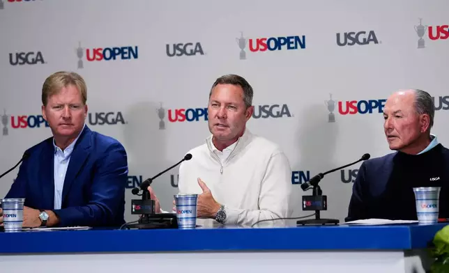 From left, United States Golf Association's President Kevin Hammeron, CEO Mike Whan and chief championships officer John Bodenhamer speak during a news conference during the U.S. Open golf tournament at Shinnecock Hills Golf Club in Southampton, N.Y., Wednesday, June 17, 2026.(AP Photo/David J. Phillip)