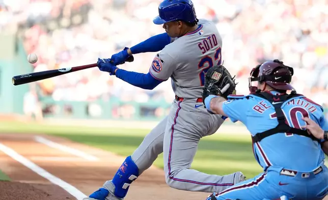 New York Mets' Juan Soto hits a home run against Philadelphia Phillies pitcher Aaron Nola during the first inning of a baseball game Thursday, June 18, 2026, in Philadelphia. (AP Photo/Matt Slocum)