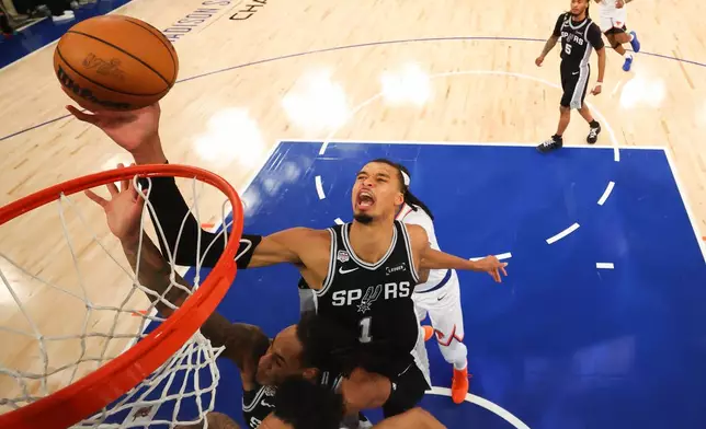 San Antonio Spurs forward Victor Wembanyama (1) shoots against the New York Knicks during the second half of Game 4 of the NBA Finals basketball series, Monday, June 8, 2026, in New York. (Al Bello/Pool Photo via AP)