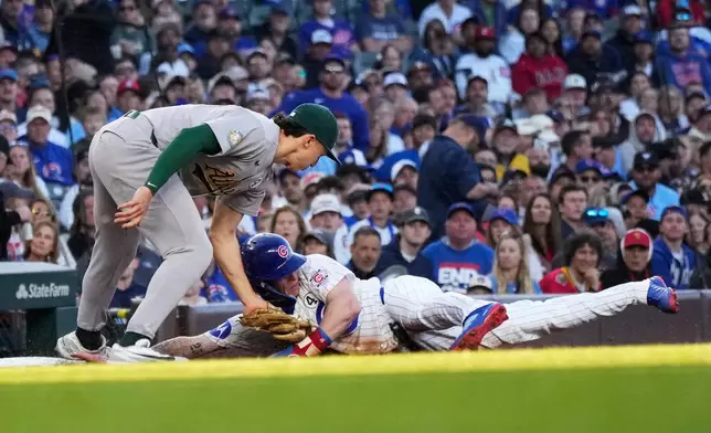 Athletics third baseman Zack Gelof, left, tags out Chicago Cubs' Pete Crow-Armstrong during the first inning of a baseball game in Chicago, Tuesday, June 2, 2026. (AP Photo/Nam Y. Huh)