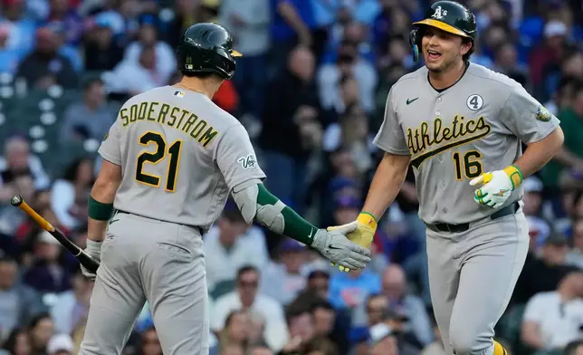 Athletics' Nick Kurtz, right, celebrates with Tyler Soderstrom after hitting a solo home run during the third inning of a baseball game against the Chicago Cubs in Chicago, Tuesday, June 2, 2026. (AP Photo/Nam Y. Huh)