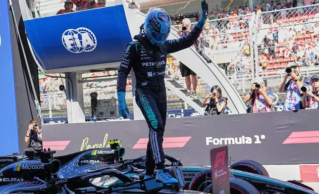 Mercedes driver George Russell of Britain celebrates his pole position after qualifying session for the Spain F1 Grand Prix at the Barcelona Catalunya racetrack in Montmelo, near Barcelona, Spain, Saturday, June 13, 2026. (AP Photo/Fatima Shbair)