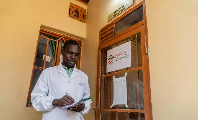 Dr Sila Jakwong'a, Medical Director of the Citadelle Clinic, stands at the entrance to his office in Bunia, Congo, Friday, June 12, 2026. (AP Photo/Moses Sawasawa)