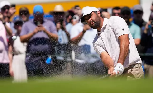 Scottie Scheffler hits from the bunker on the first hole during the third round of the U.S. Open golf tournament at Shinnecock Hills Golf Club in Southampton, N.Y., Saturday, June 20, 2026.(AP Photo/David J. Phillip)