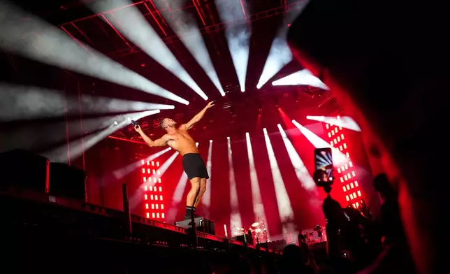 American singer Dan Reynolds of Imagine Dragons performs at the World Cup Fan Zone in Monterrey, Mexico, Sunday, June 21, 2026. (AP Photo/Matias Delacroix)