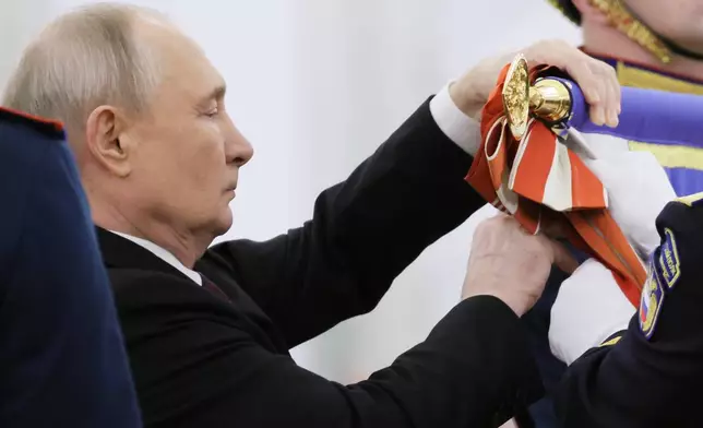 Russian President Vladimir Putin attends a ceremony to present the Order of Zhukov to the Presidential Regiment of the Russian Federal Guard Service at the Kremlin's St. George Hall in Moscow, Tuesday, June 23, 2026. (Mikhail Metzel/Sputnik, Kremlin Pool Photo via AP)