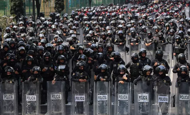 Police officers block a street to the stadium ahead of the opening match of the 2026 FIFA World Cup between Mexico and South Africa in Mexico City, Thursday, June 11, 2026. (AP Photo/Ginnette Riquelme)