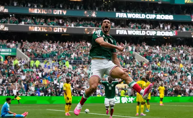 Mexico's Raul Jimenez celebrates after scoring his side's second goal during the World Cup Group A soccer match between Mexico and South Africa in Mexico City, Thursday, June 11, 2026. (AP Photo/Natacha Pisarenko)