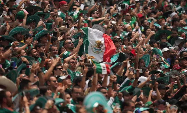 Mexican fans cheer before the World Cup Group A soccer match between Mexico and South Africa in Mexico City, Thursday, June 11, 2026. ((AP Photo/Silvia Izquierdo)