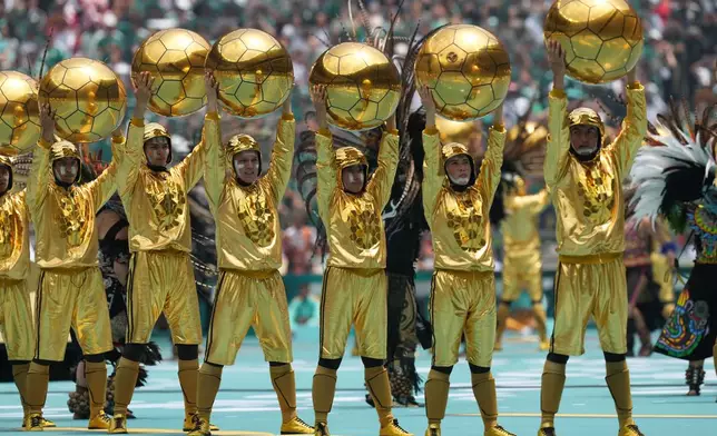 Performers take part in the openinig ceremony before the World Cup Group A soccer match between Mexico and South Africa in Mexico City, Thursday, June 11, 2026. ((AP Photo/Silvia Izquierdo)