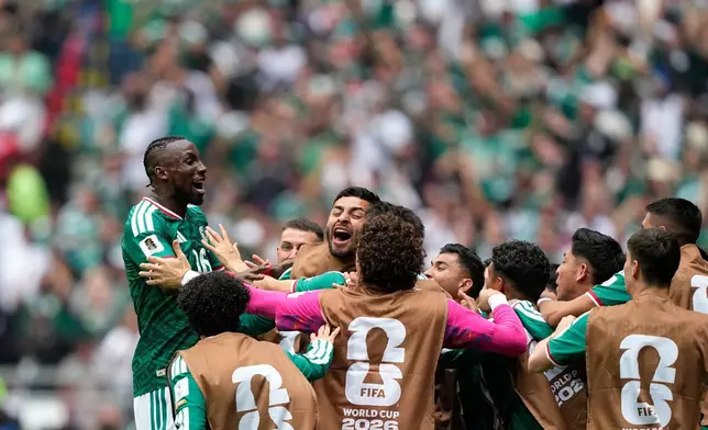 Mexico's Julian Quinones, left, celebrates after scoring the opening goal during the World Cup Group A soccer match between Mexico and South Africa in Mexico City, Thursday, June 11, 2026. (AP Photo/Natacha Pisarenko)