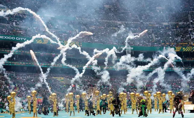 Performers on the pitch during the opening ceremony before the start of the World Cup Group A soccer match between Mexico and South Africa in Mexico City, Thursday, June 11, 2026. (AP Photo/Natacha Pisarenko)