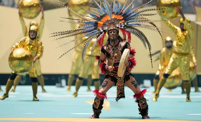 Performers on the pitch during the opening ceremony before the start of the World Cup Group A soccer match between Mexico and South Africa in Mexico City, Thursday, June 11, 2026. (AP Photo/Natacha Pisarenko)