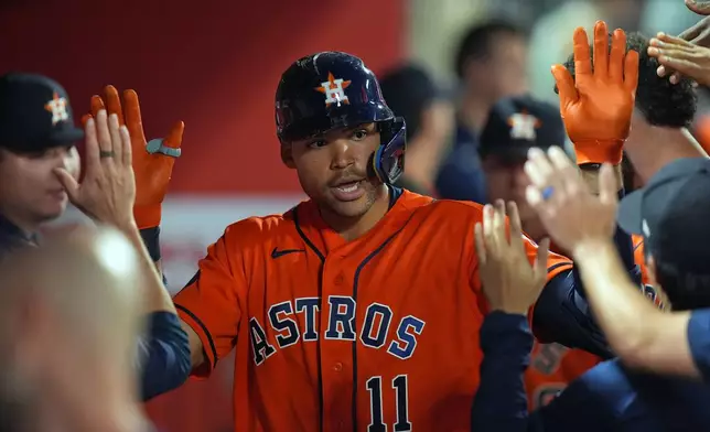 Houston Astros Cam Smith celebrates his game-tying solo home run against the Los Angeles Angels during the eighth inning of a baseball game, Wednesday, June 10, 2026, in Anaheim, Calif. (AP Photo/Scott Strazzante)