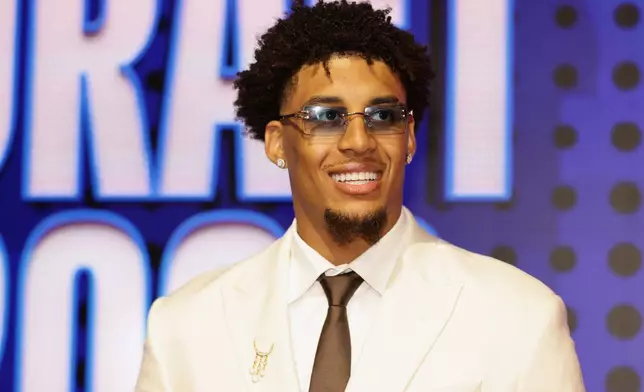 Yaxel Lendeborg arrives for the first round of the NBA basketball draft Tuesday, June 23, 2026, in New York. (AP Photo/Adam Hunger)