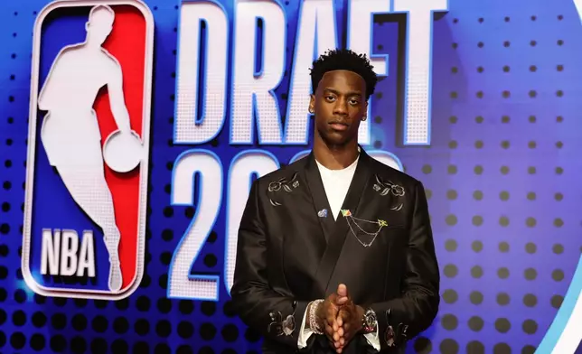 AJ Dybantsa arrives for the first round of the NBA basketball draft Tuesday, June 23, 2026, in New York. (AP Photo/Adam Hunger)