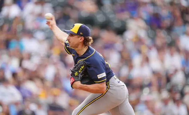 Milwaukee Brewers starting pitcher Brandon Sproat works against the Colorado Rockies in the first inning of a baseball game Friday, June 5, 2026, in Denver. (AP Photo/David Zalubowski)
