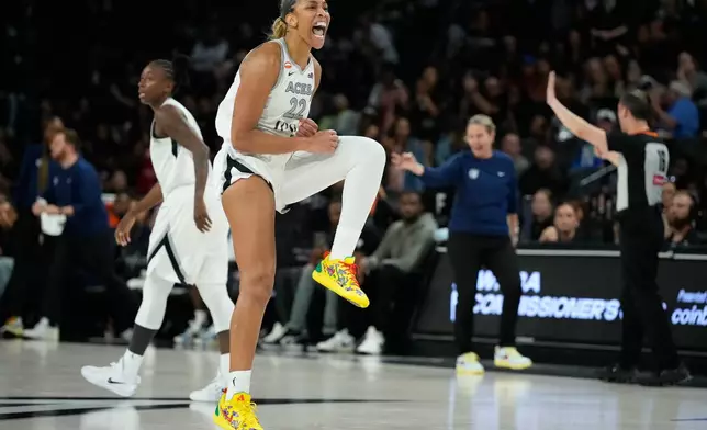 Las Vegas Aces center A'ja Wilson (22) celebrates after a play against the Minnesota Lynx during the second half of a WNBA basketball game Saturday, June 13, 2026, in Las Vegas. (AP Photo/John Locher)