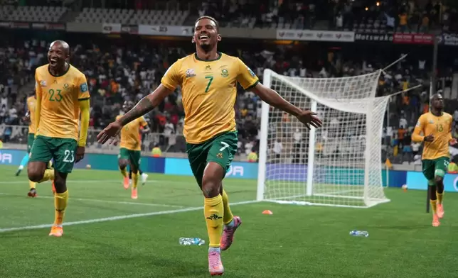 FILE - South Africa's Oswin Appollis celebrates after scoring his side's second goal during a World Cup 2026 group C qualifying soccer match between South Africa and Rwanda at Mbombela Stadium, in Nelspruit, South Africa, Oct. 14, 2025. (AP Photo/Alfonso Nqunjana, File)