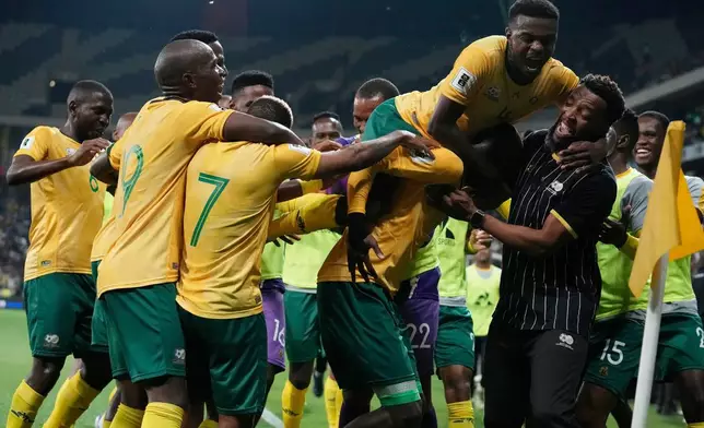 FILE - South Africa players celebrate their side's third goal during a World Cup 2026 group C qualifying soccer match between South Africa and Rwanda at Mbombela Stadium, in Nelspruit, South Africa, Oct. 14, 2025. (AP Photo/Themba Hadebe, File)