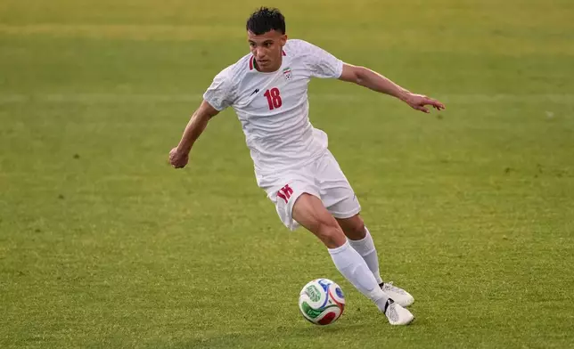 Iran's Amirhossein Hosseinzadeh plays the ball during a friendly soccer match between Iran and Gambia, in Antalya, southern Turkey, Friday, May 29, 2026. (AP Photo/Khalil Hamra)