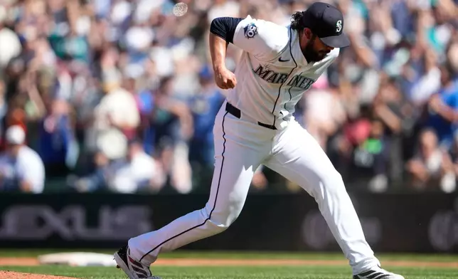 Seattle Mariners relief pitcher Andrés Muñoz reacts after earning the save in a win over the Baltimore Orioles in a baseball game, Thursday, June 18, 2026, in Seattle. (AP Photo/Lindsey Wasson)