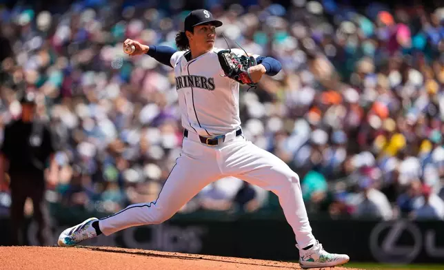 Seattle Mariners starting pitcher Bryan Woo throws against the Baltimore Orioles during the second inning of a baseball game, Thursday, June 18, 2026, in Seattle. (AP Photo/Lindsey Wasson)