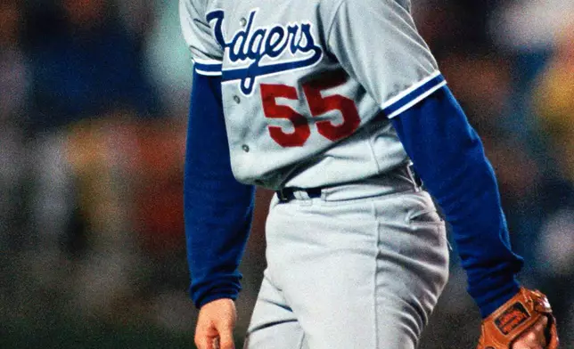 FILE - Los Angeles Dodgers Pitcher Orel Hershiser is all smiles as he watches the final out during his record setting performance on Oct. 3, 1988 in San Diego. (AP Photo/Lenny Ignelzi, file)