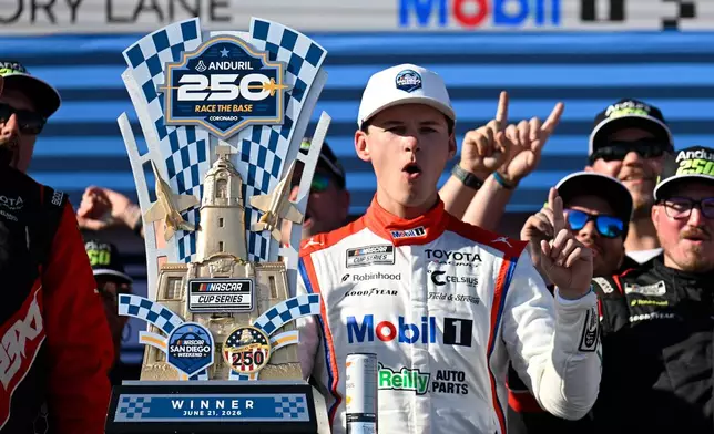 Cory Heim celebrates in Victory Lane after winning a NASCAR Cup Series auto race, Sunday, June 21, 2026, in Coronado, Calif. (AP Photo/Denis Poroy)