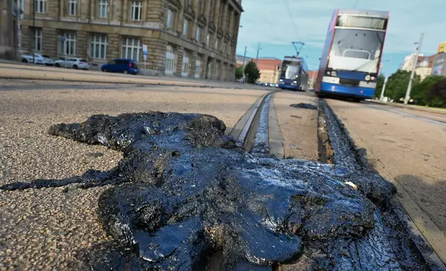 A prolonged heat wave with high temperatures exceeding caused significant damage to the tram infrastructure in Leipzigv Germany on Saturday, June 27, 2026. (Heiko Rebsch/dpa via AP)
