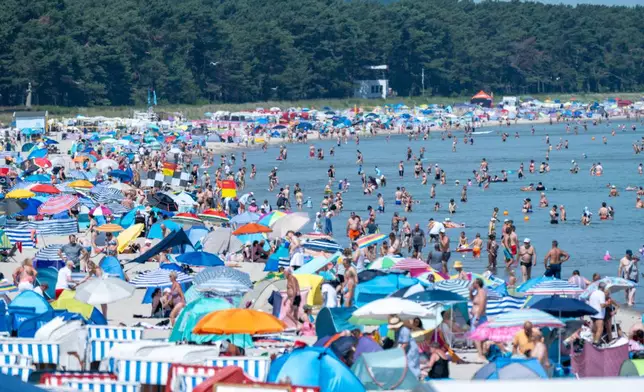 People crowd the beach at the seaside resort on the island of Rügen, Germany, Saurday, June 27, 2026, as the heat wave continues over Europe. (Stefan Sauer/dpa via AP)