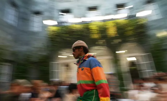 A model wears a creation as part of the Ralph Lauren Spring/Summer 2027 men's collection presented in Milan, Italy, Friday, June 19, 2026. (AP Photo/Antonio Calanni)
