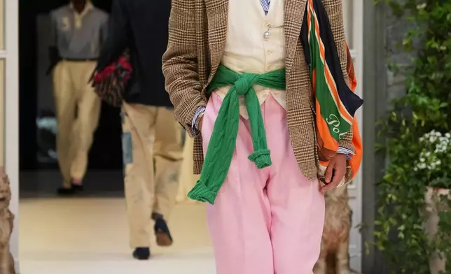 A model wears a creation as part of the Ralph Lauren Spring/Summer 2027 men's collection presented in Milan, Italy, Friday, June 19, 2026. (AP Photo/Antonio Calanni)