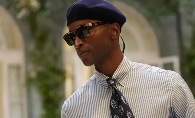 A model wears a creation as part of the Ralph Lauren Spring/Summer 2027 men's collection presented in Milan, Italy, Friday, June 19, 2026. (AP Photo/Antonio Calanni)