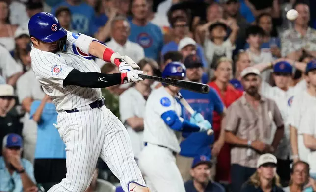 Chicago Cubs' Seiya Suzuki of Japan, hits a walk-off one-run single during the ninth inning of a baseball game against the San Diego Padres in Chicago, Monday, June 29, 2026. (AP Photo/Nam Y. Huh)