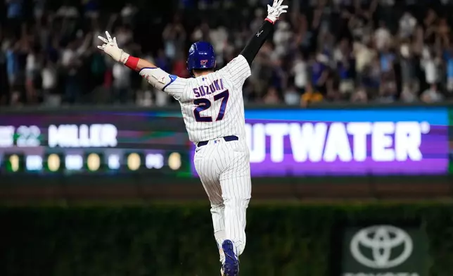 Chicago Cubs' Seiya Suzuki of Japan, celebrates after hitting a walk-off one-run single during the ninth inning of a baseball game against the San Diego Padres in Chicago, Monday, June 29, 2026. (AP Photo/Nam Y. Huh)