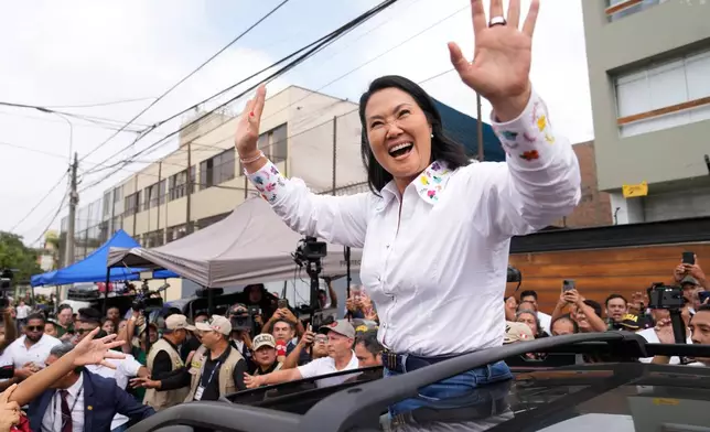 Presidential candidate Keiko Fujimori, of the Popular Force party, waves after voting during the presidential runoff election in Lima, Peru, Sunday, June 7, 2026. (AP Photo/Martin Mejia)