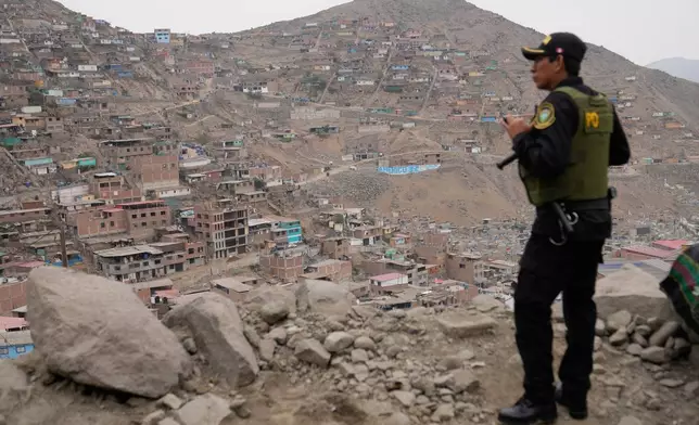 A police officers guard the site where presidential candidate Keiko Fujimori of the Popular Force party meets supporters for breakfast during the presidential runoff election in Lima, Peru, Sunday, June 7, 2026. (AP Photo/Martin Mejia)