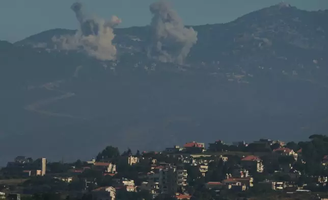 Smokes rise to the sky following an Israeli military strike in southern Lebanon as seen from northern Israel, Friday, June 19, 2026. (AP Photo/Leo Correa)
