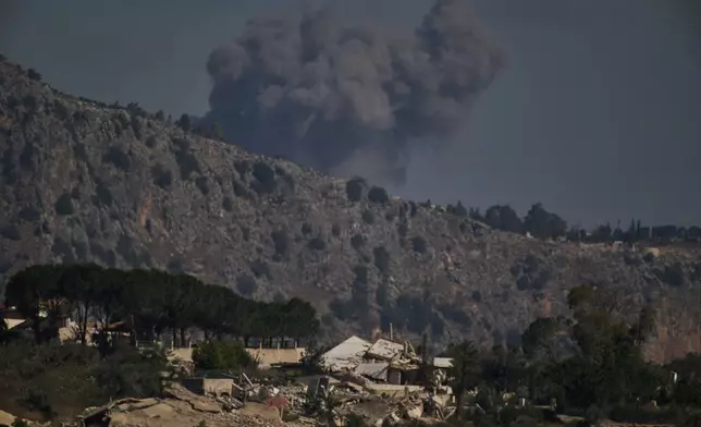 Smoke rises to the sky in an area near Beaufort Castle following an Israeli military strike in southern Lebanon as seen from northern Israel, Friday, June 19, 2026. (AP Photo/Leo Correa)
