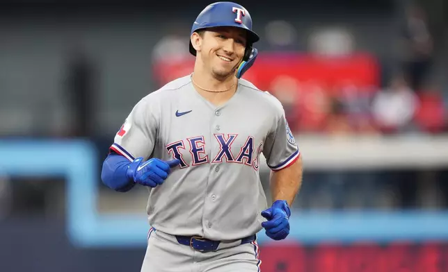 Texas Rangers' Wyatt Langford (36) rounds the bases after hitting a three-run home run against the Toronto Blue Jays during the third inning of a baseball game in Toronto, Thursday, June 25, 2026. (Nathan Denette/The Canadian Press via AP)