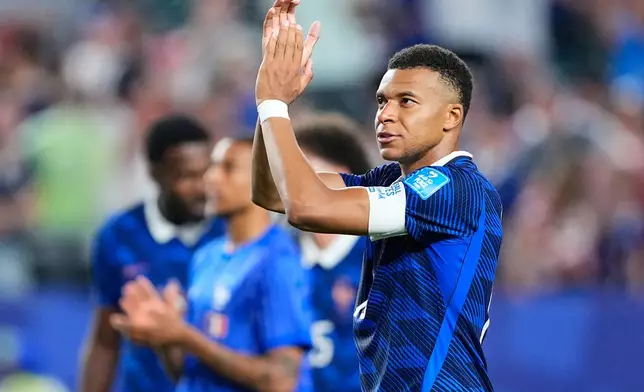 France's Kylian Mbappe (10) and his teammates gesture to fans following the World Cup Group I soccer match between France and Iraq in Philadelphia, Monday, June 22, 2026. (AP Photo/Petr David Josek)
