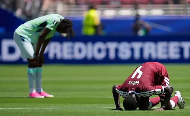 FILE - Qatar's Issa Laye prays after the World Cup Group B soccer match between Qatar and Switzerland in Santa Clara, Calif., June 13, 2026. (AP Photo/Eugene Hoshiko, File)