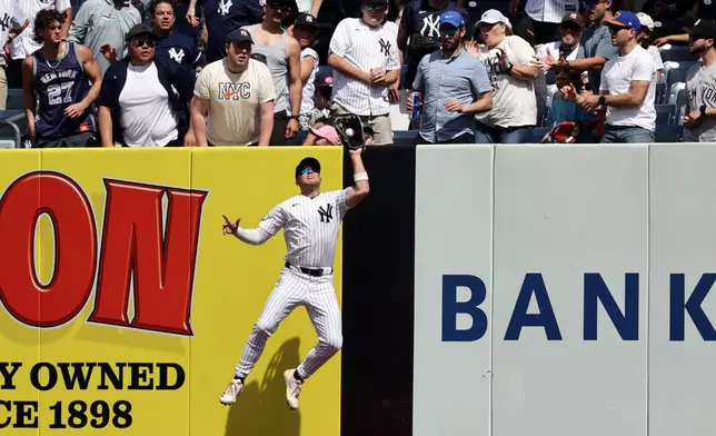 New York Yankees shortstop Max Schuemann makes a catch on a flyout by Cleveland Guardians' Brayan Rocchio during the seventh inning of a baseball game Thursday, June 4, 2026, in New York. (AP Photo/Adam Hunger)