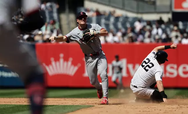 Cleveland Guardians second baseman Travis Bazzana throws to first after getting a force out on New York Yankees' Benb Rice to complete the double play on Paul Goldschmidt at first base during the sixth inning of a baseball game Thursday, June 4, 2026, in New York. (AP Photo/Adam Hunger)