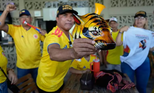 Supporters of presidential candidate Abelardo de la Espriella of the Defenders of the Motherland movement celebrate election results in Barranquilla, Colombia, Sunday, May 31, 2026. (AP Photo/Fernando Vergara)
