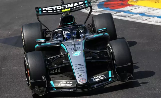 Italy's Andrea Kimi Antonelli steers his Mercedes during the Formula One Monaco Grand Prix race at the Monaco racetrack, Sunday, June 7, 2026. (Yves Herman, Pool Photo via AP)